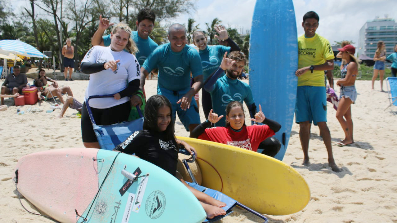 adaptive surfers at the beach