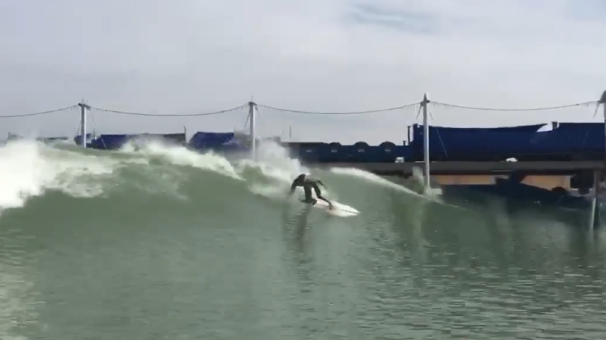 Scott Bass surfs Kelly's wave pool