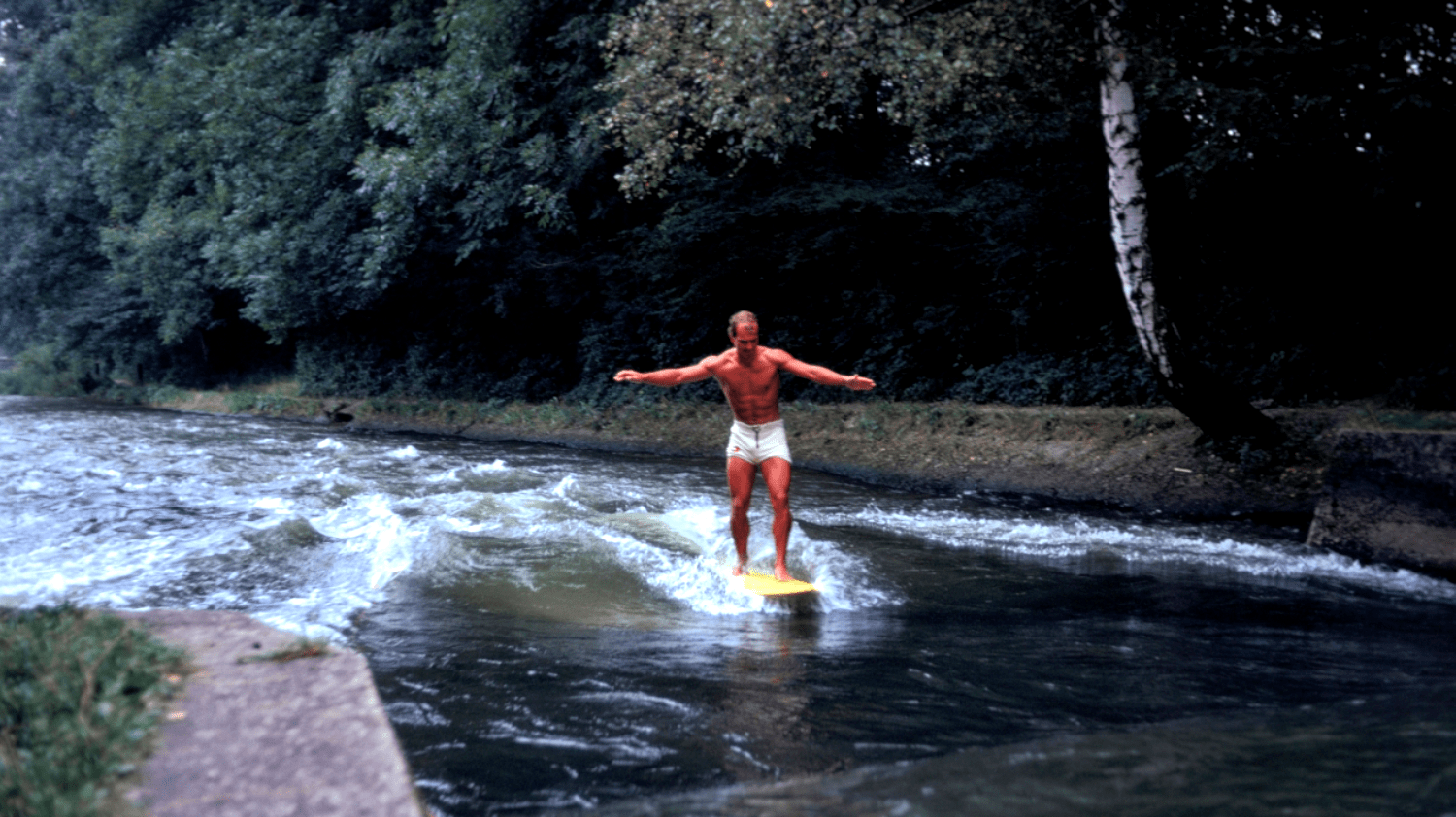 the first-ever photo taken of a surfer riding a rapid in Munich