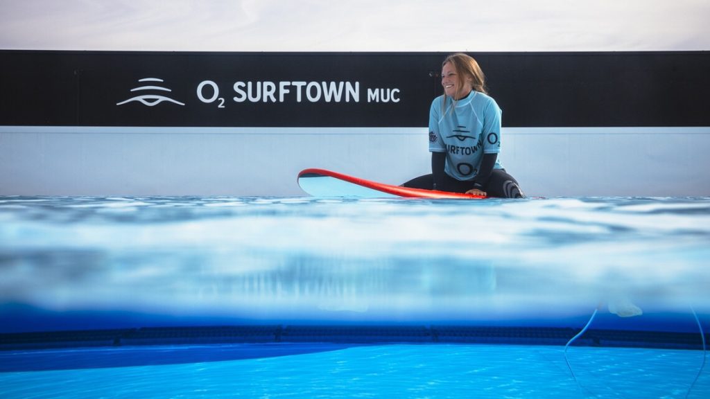 Surfers training at Germany’s first artificial wave pool under expert coaching.